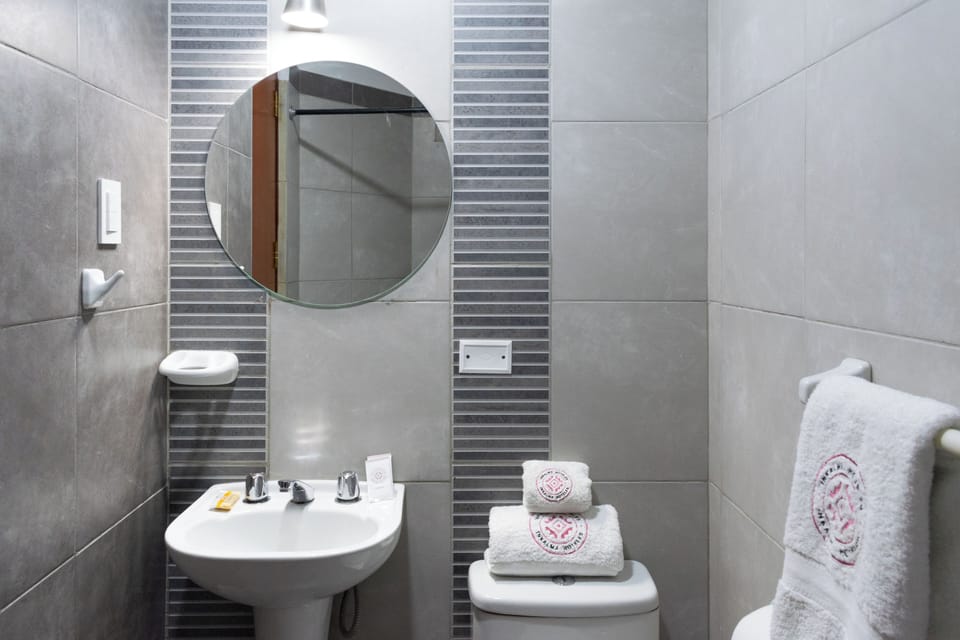 Shower, rainfall showerhead, hair dryer, towels