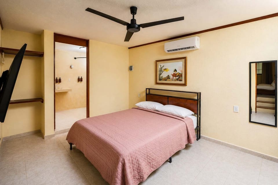 Queen Bed with Window and Blackout Curtains
Designed for deep rest — natural light and garden view by day, blackout privacy by night.