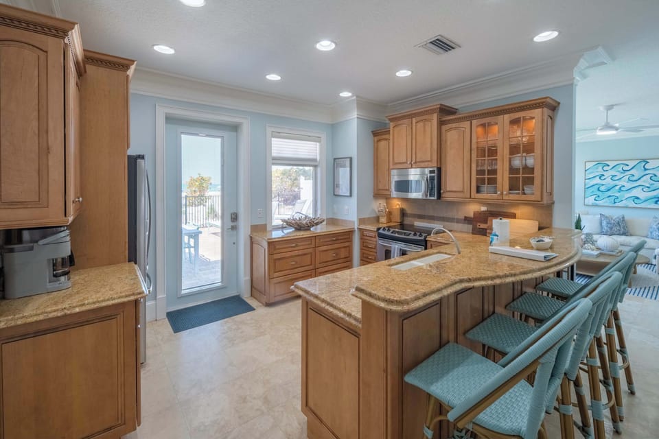 Spacious kitchen with island and bar seating