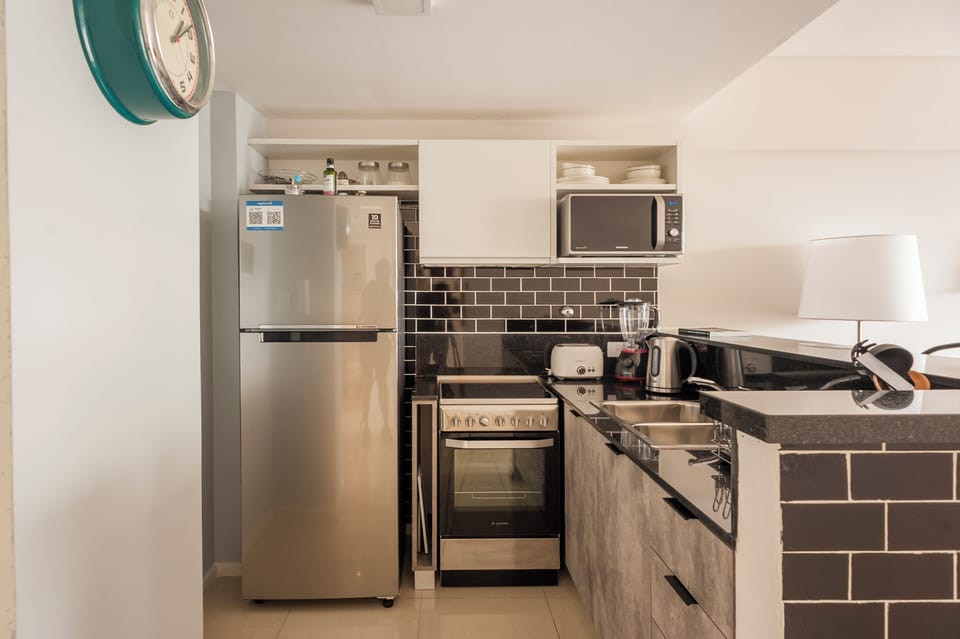 Comfort Apartment, City View | Private kitchen | Microwave, oven, stovetop, coffee/tea maker