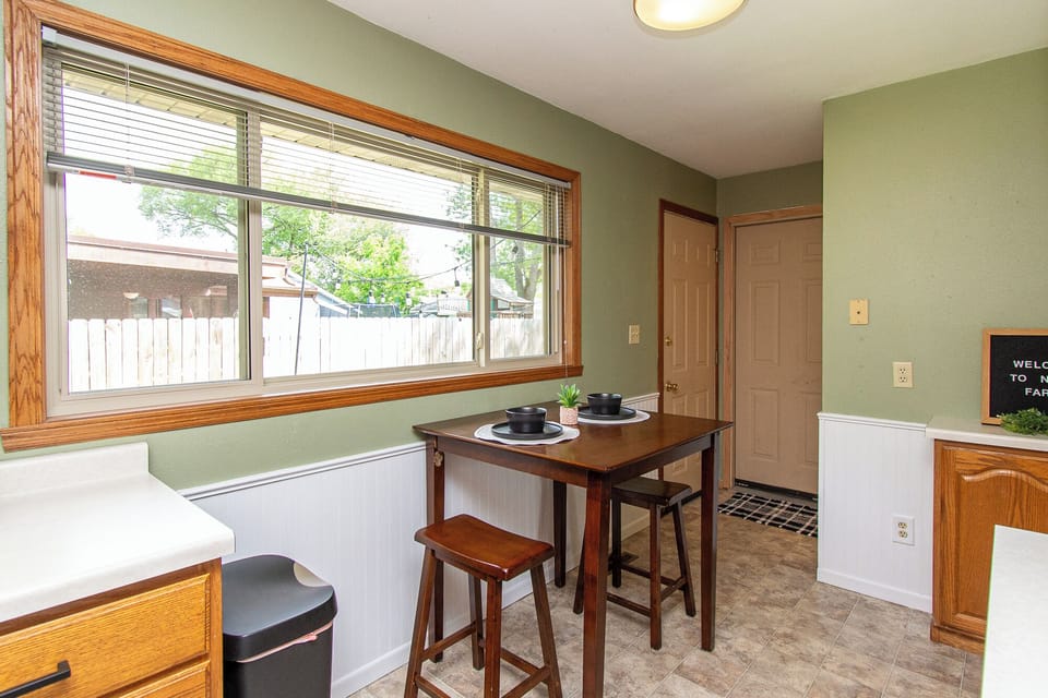 [Dining area] The table seats two comfortably, but can be expanded to accommodate four by moving the table and using two chairs from the kitchen island