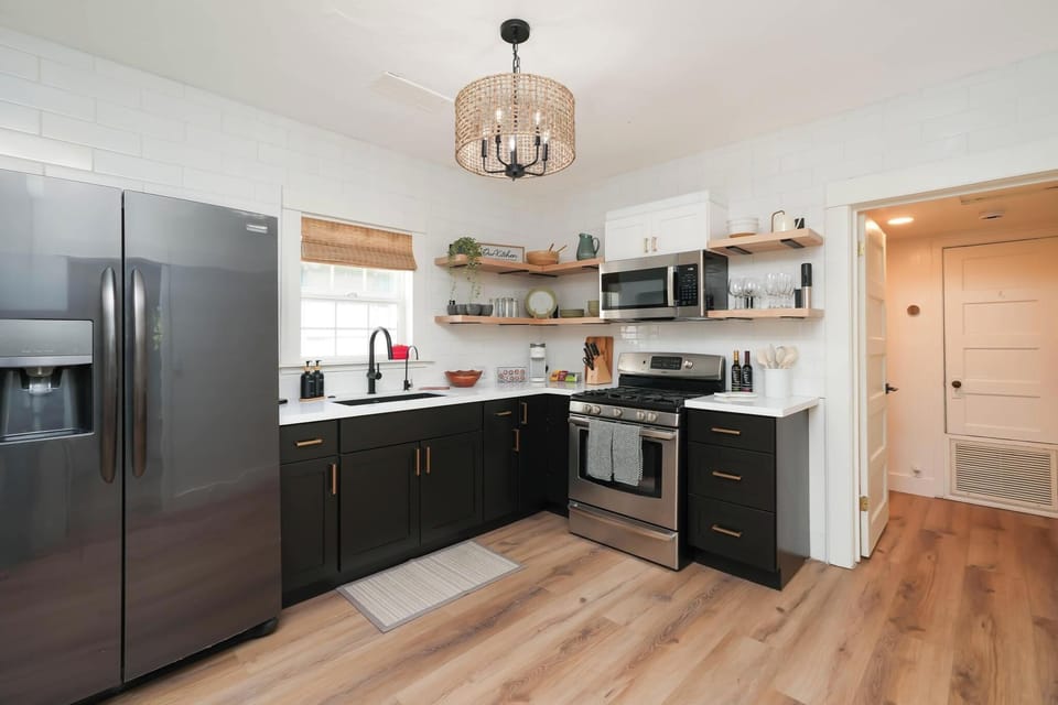 Whip up meals in the spacious kitchen featuring stainless steel appliances, granite countertops, and plenty of room for sharing.