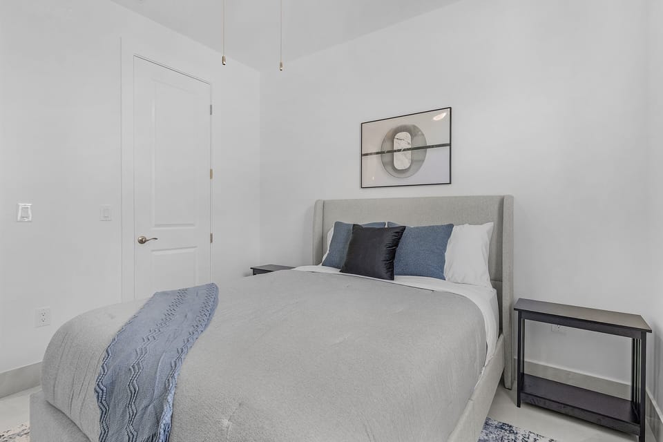 guest room 2 is equipped with a queen bed also has full closet access