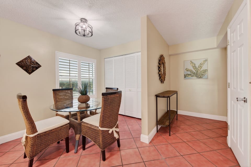 Gather for meals or game night with seating for four at the bright and beachy dining table