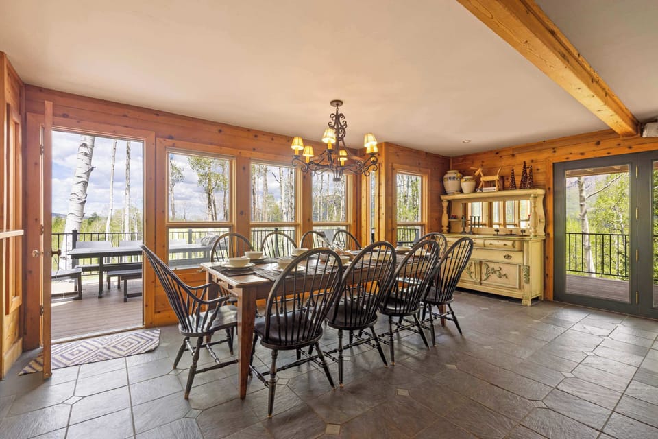 Dining area: Main floor, table seating for 10, deck access, adjacent to living room