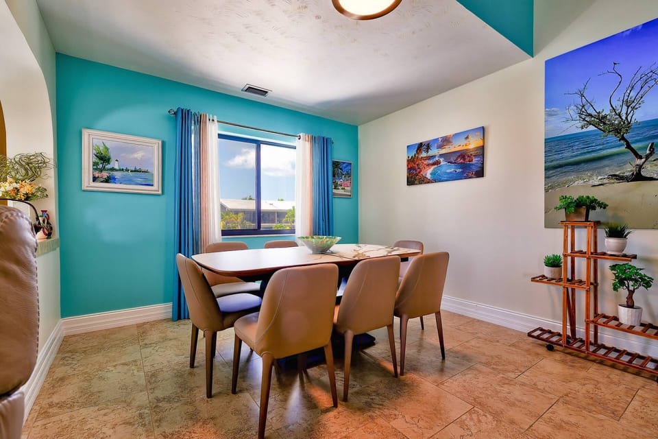 The dining table comfortably seats eight, perfect for enjoying meals with family and friends.