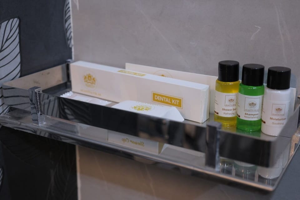 Deluxe Room, Resort View | Bathroom amenities | Shower, hair dryer, slippers, towels