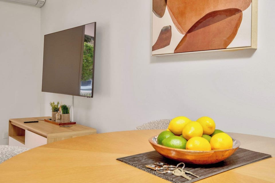 Wall mounted flat screen smart TV in living area