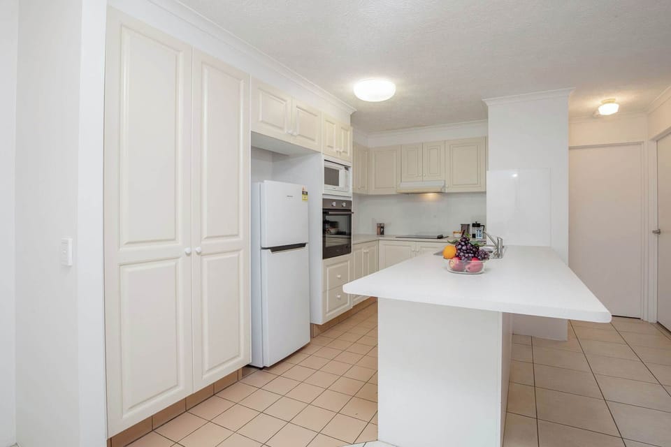 functional kitchen with wall oven, microwave and dishwasher