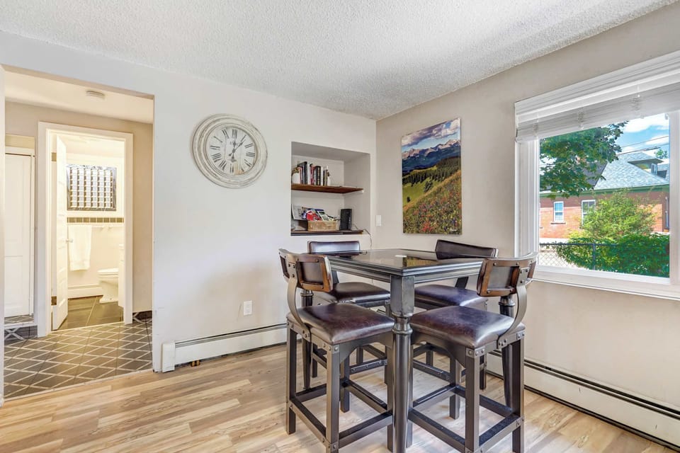 Enjoy meals, games, or a morning coffee at the bistro-style dining table set next to bright windows with charming neighborhood views.


2/2







