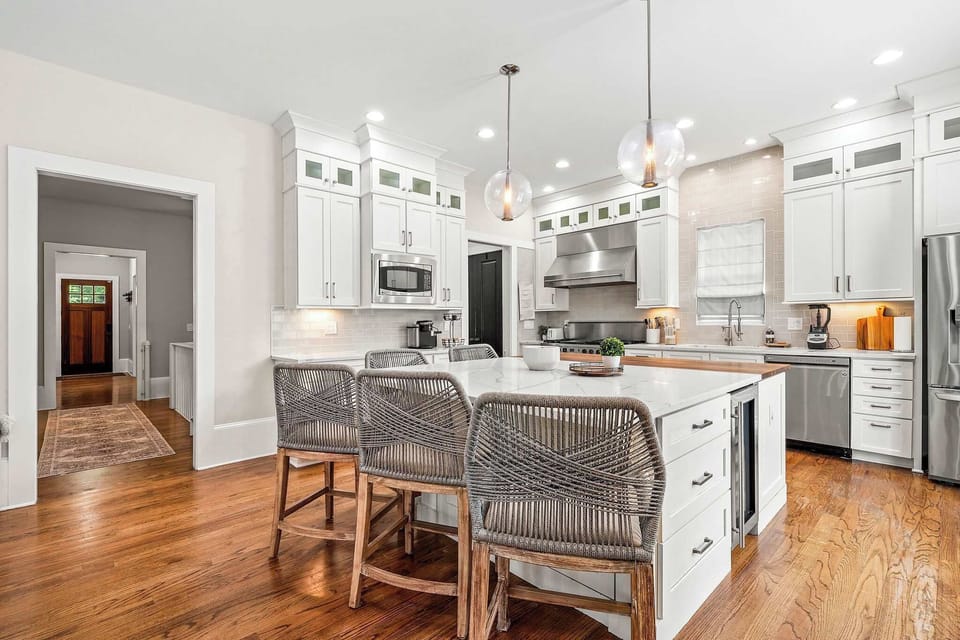 Our fully stocked kitchen boasts high-end appliances and a large island with high seating — oh so luxurious and perfect for gathering and cooking in style.