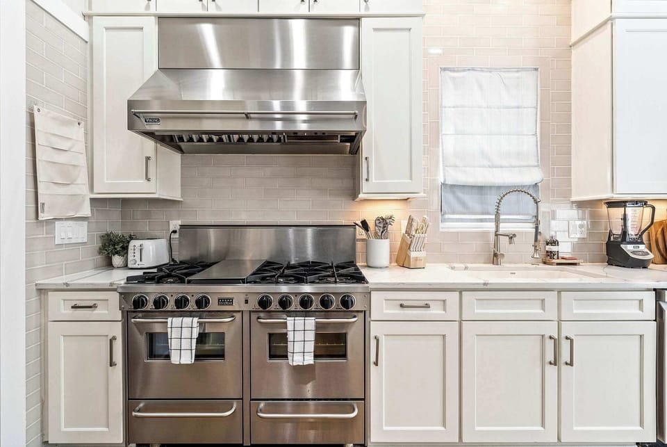 Sleek high-end appliances meet abundant cabinetry — where function and luxury come together.