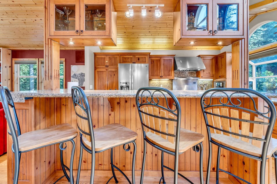 Kitchen: Main floor, drip coffee maker, Crockpot, toaster, cooking utensils, tableware