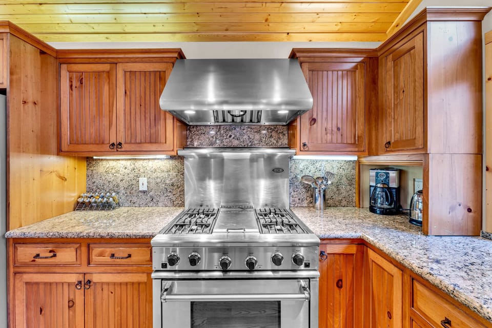 Kitchen: Main floor, drip coffee maker, Crockpot, toaster, cooking utensils, tableware