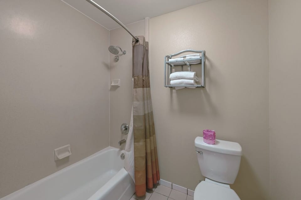 Desk, laptop workspace, blackout drapes, iron/ironing board