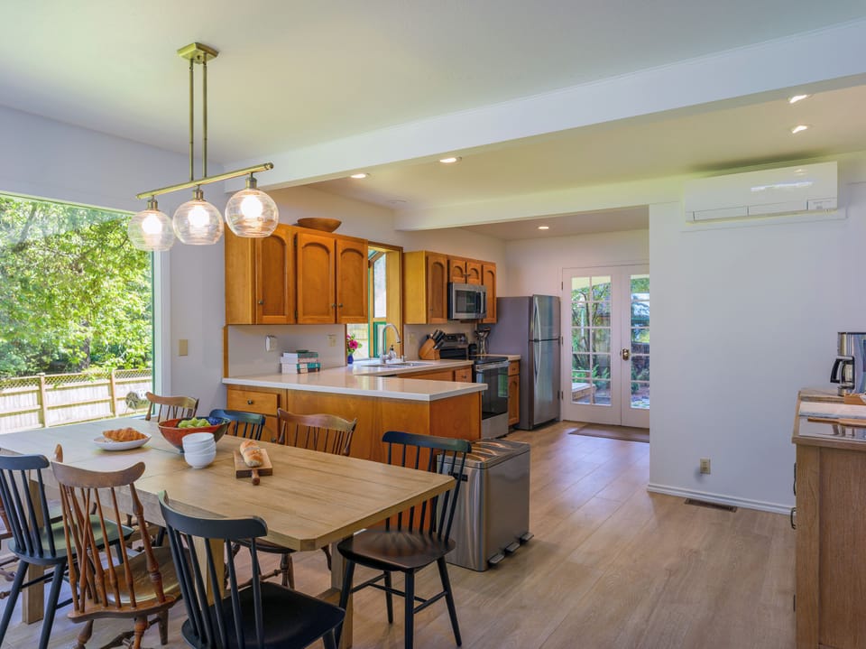 Open kitchen with counter space, seating and a dedicated coffee bar