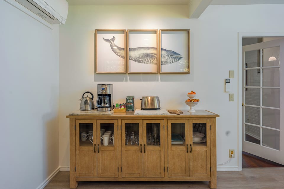 Dedicated coffee bar with Cuisinart drip coffeemaker, electric kettle, coffee grinder, French Press, coffee bar with sweeteners, tea and Peet's Organic coffee.