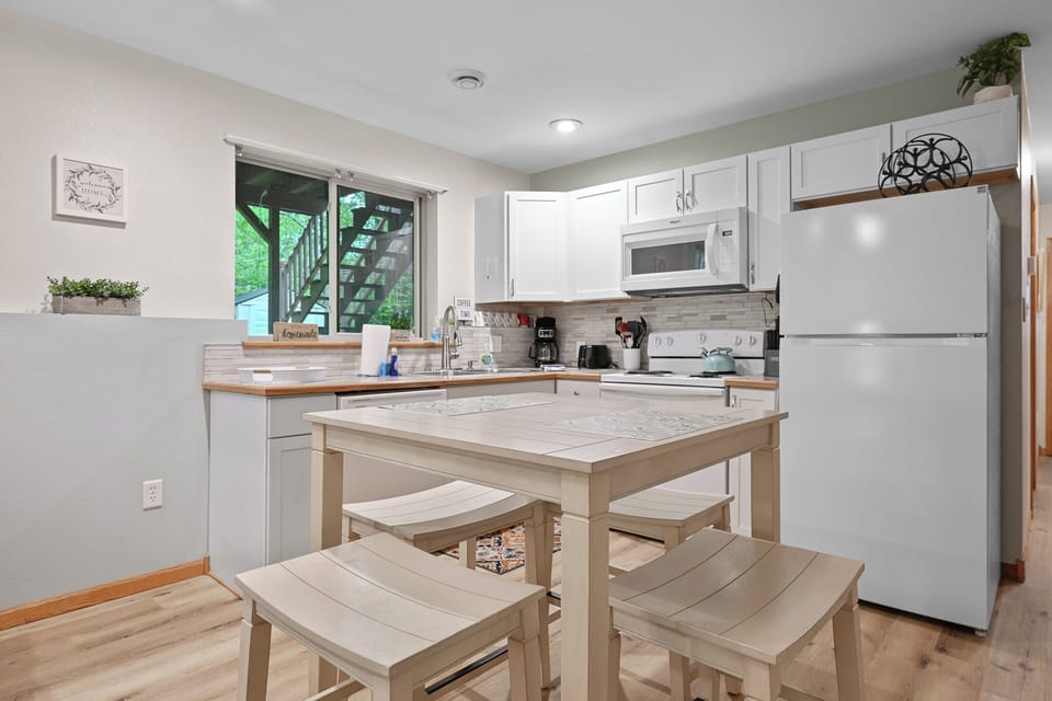 Clean kitchen with convenient dining space.