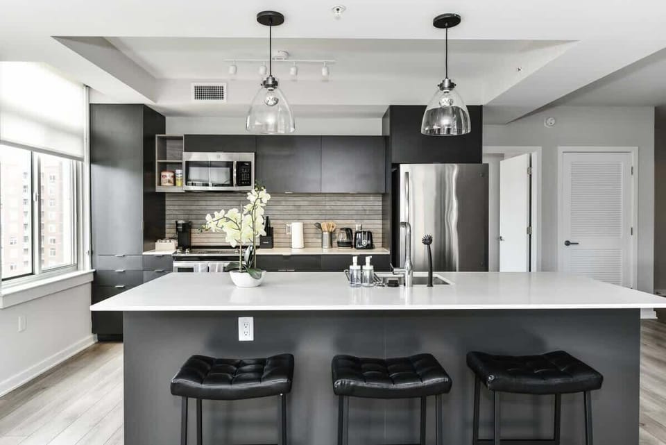 Fully equipped kitchen with a breakfast counter (seats 3) and a dining area (seats 4), plus a high chair available for little ones.