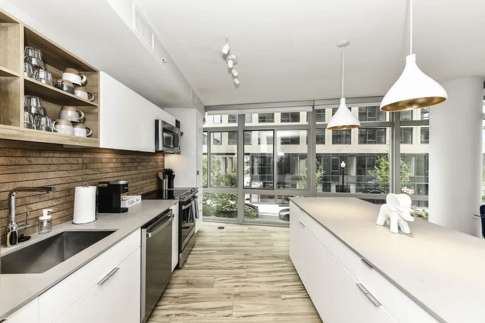 Fully equipped kitchen with a breakfast counter (seats 3) and a dining area (seats 4), plus a high chair available for little ones.