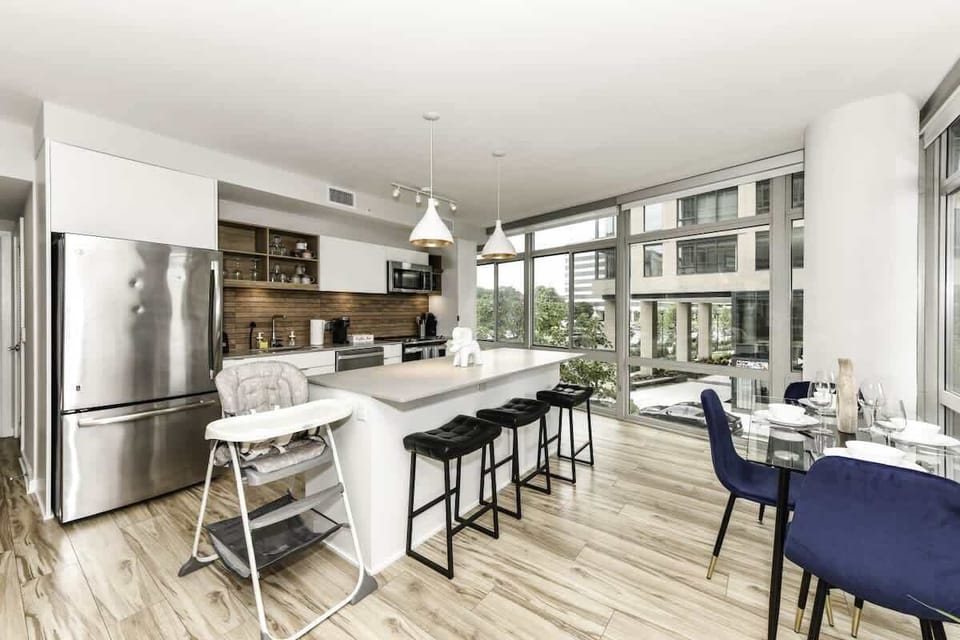 Fully equipped kitchen with a breakfast counter (seats 3) and a dining area (seats 4), plus a high chair available for little ones.