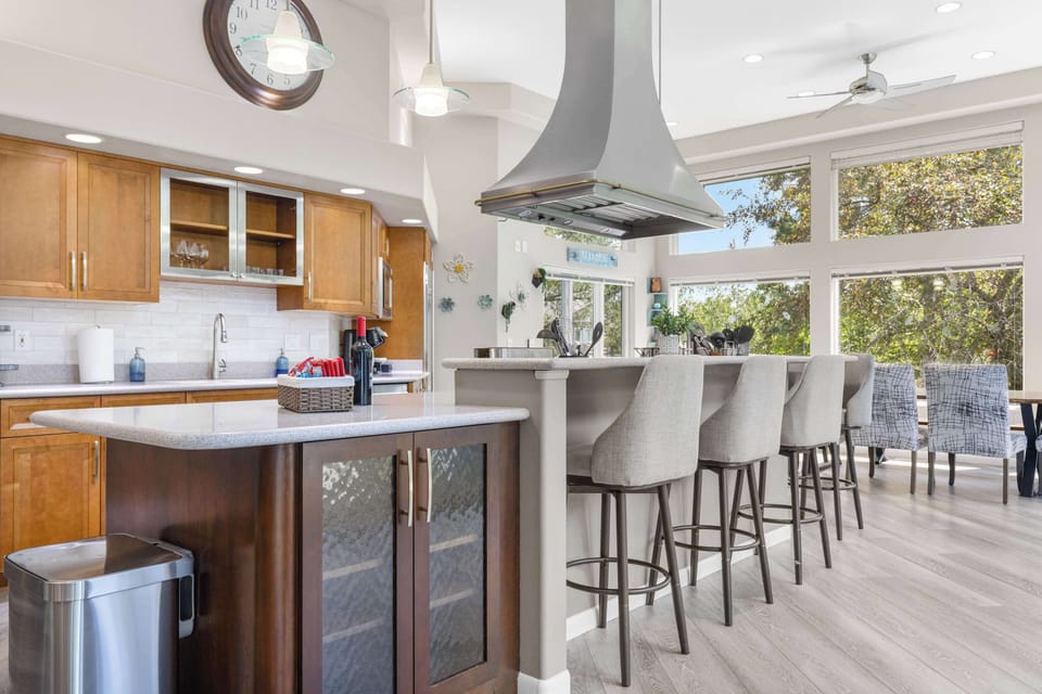 Bar top seating allows for guests to still visit while making their favorite dishes.