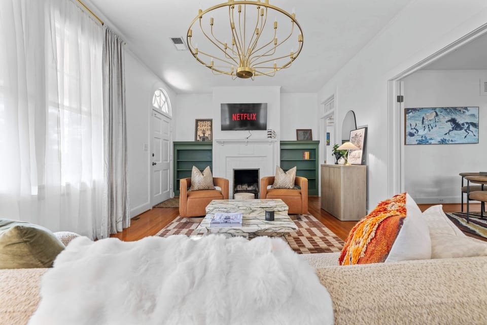 "Cozy up in the chic living room with Netflix, plush seating, and warm natural light — perfect for relaxing after a day of exploring."
