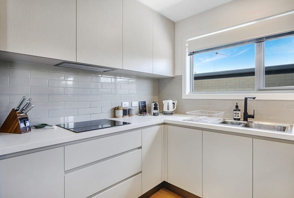 Sunny kitchen with all new modern appliances.