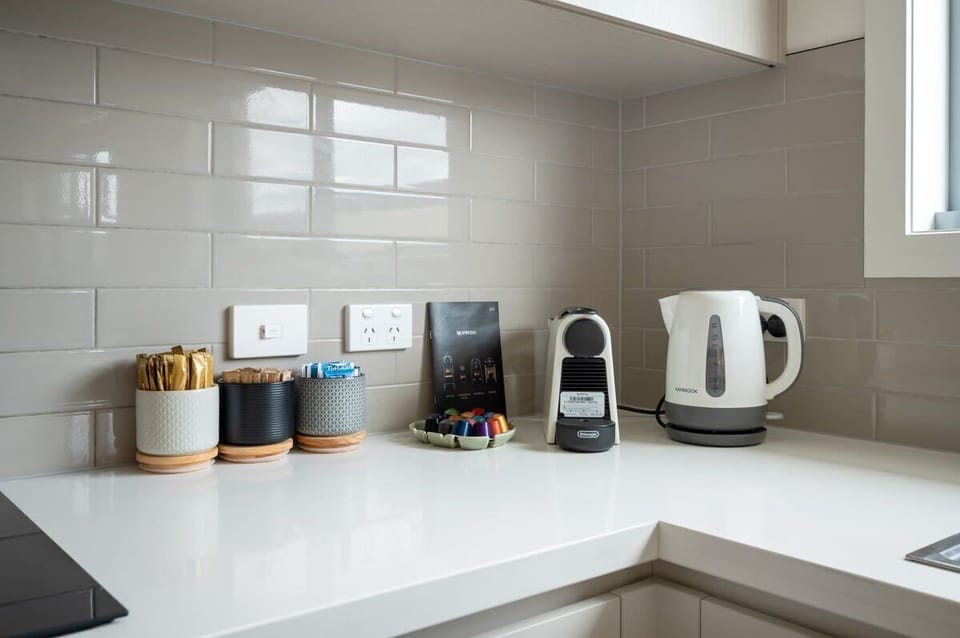 Well-appointed kitchen with Nespresso coffee machine.