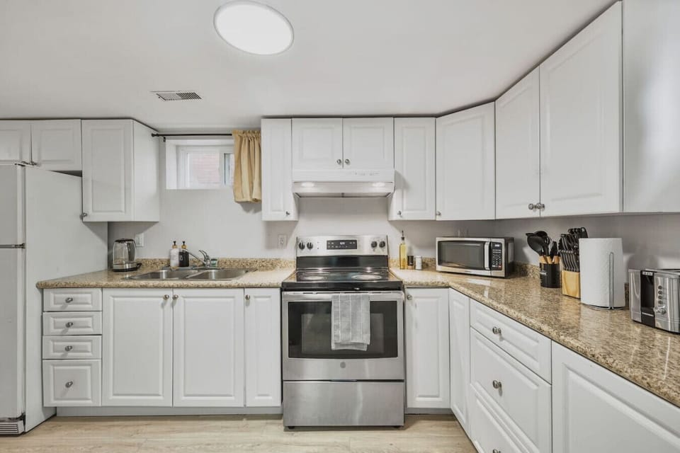 Whip up your favorite meals in this fully equipped kitchen featuring sleek stainless steel appliances, spacious counters, and all the essentials you need for a comfortable and convenient stay.