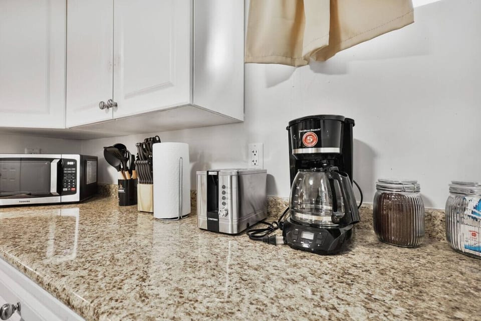 Start your mornings right with fresh coffee, crispy toast, or a quick bite warmed in the microwave. This kitchen corner is stocked with all the essentials to make your stay easy and enjoyable.