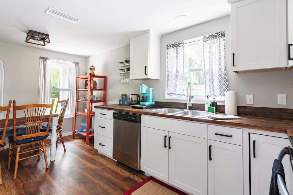 Charming Modern fully-stocked Kitchen with new appliances plus Cozy Dining Table for 6 people.