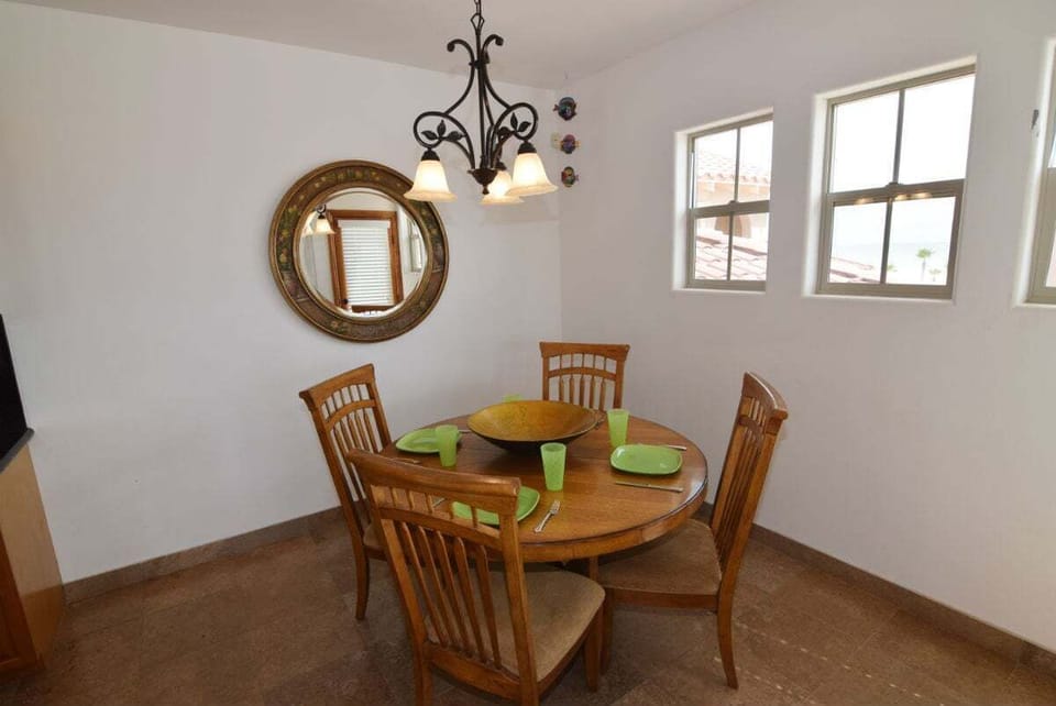 The dining table offers comfortable seating and easy access from the kitchen — perfect for enjoying home‑cooked meals together.