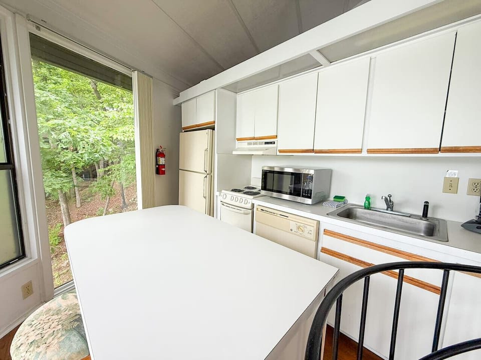 A closer look at the fully equipped kitchen, ready for all your culinary needs during your lakefront escape.
