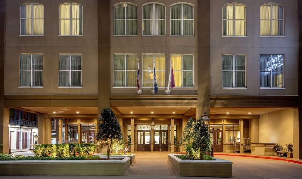Hyatt Centric French Quarter front entrance and bright lighting at night