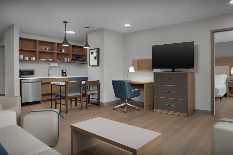 Suite, 1 Bedroom | Desk, laptop workspace, blackout drapes, iron/ironing board