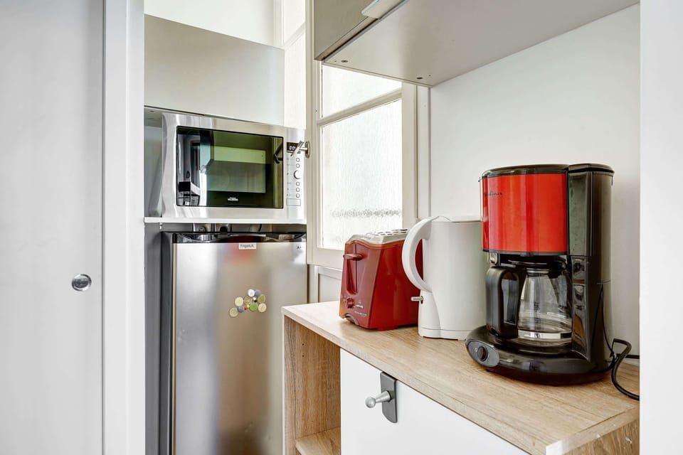 The kitchen is fully equipped to prepare a simple meal 