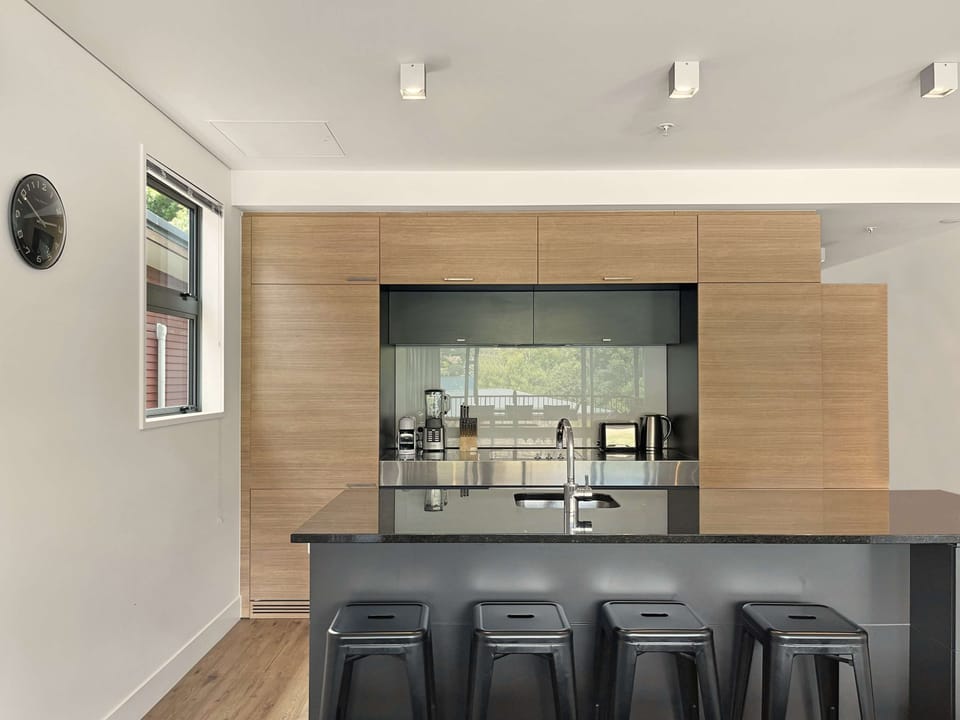 Sleek kitchen with breakfast bar seating