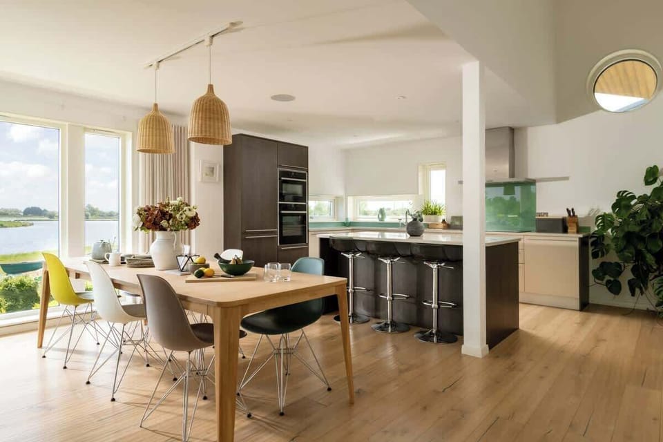 Step into a kitchen and dining area made for connection - with a breakfast island, lake views, and space to linger over slow mornings or shared dinners.