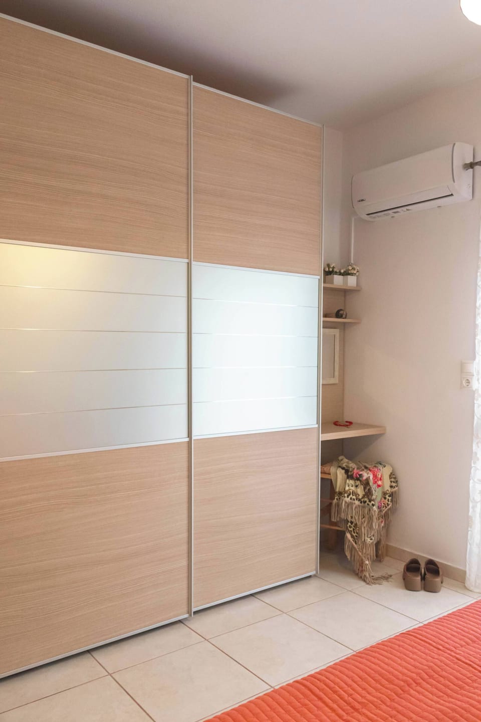 Room with Wardrobe and Natural Lighting
Closet space with hanging and shelving options, shown clean and organized.