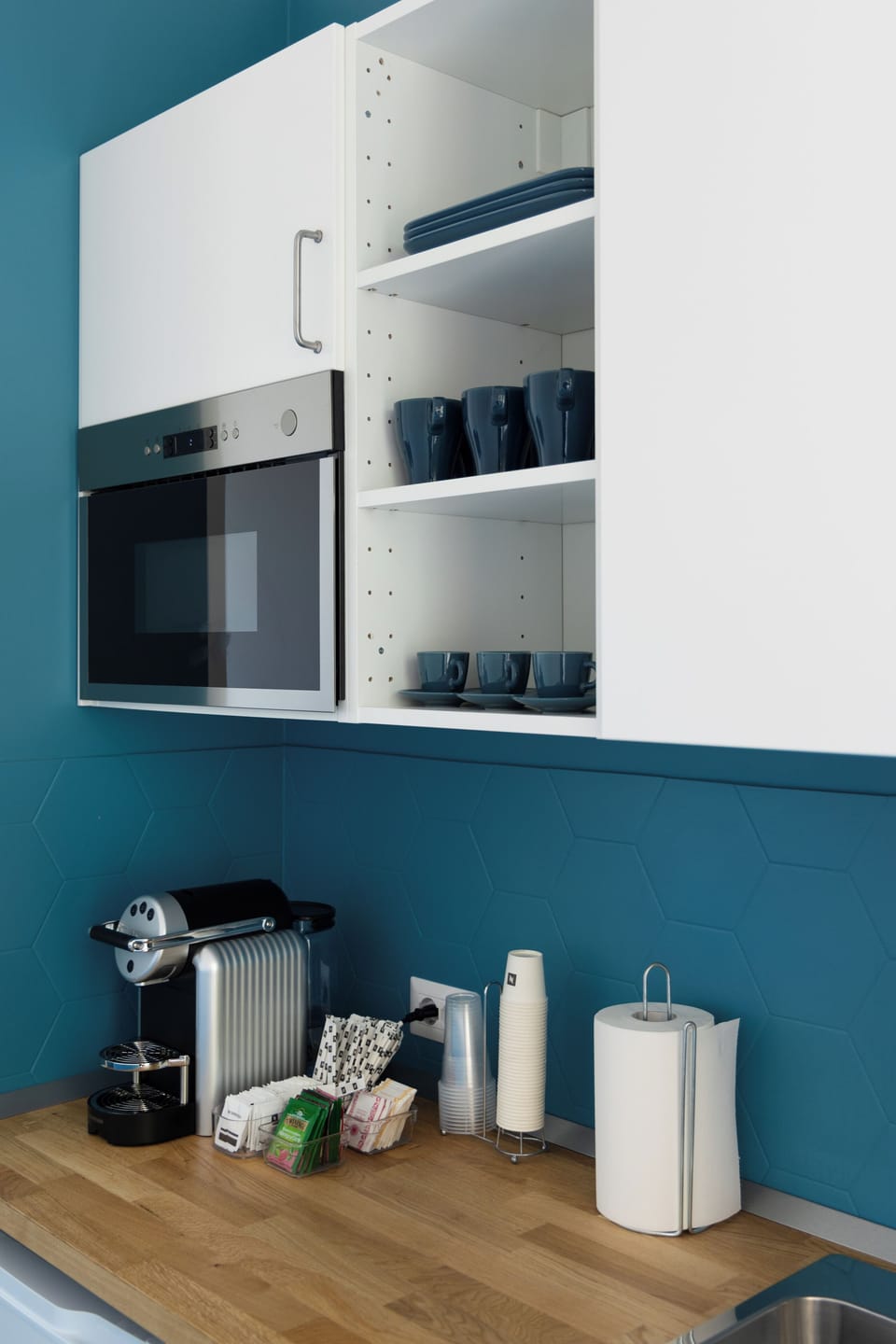 Mini-fridge, oven, stovetop, cookware/dishes/utensils
