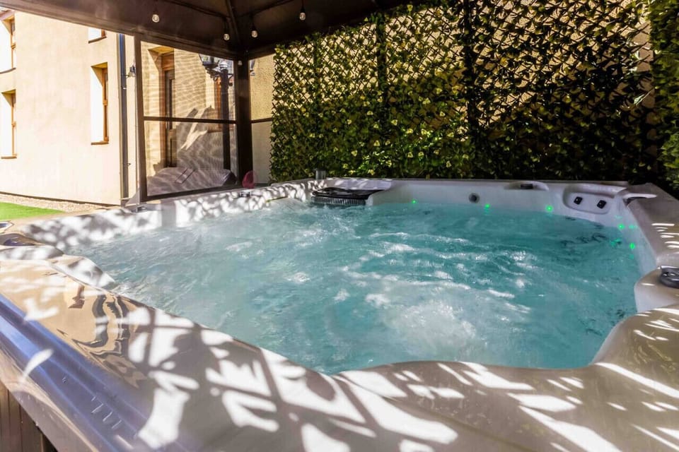 Relax and unwind in this cozy hot tub oasis!