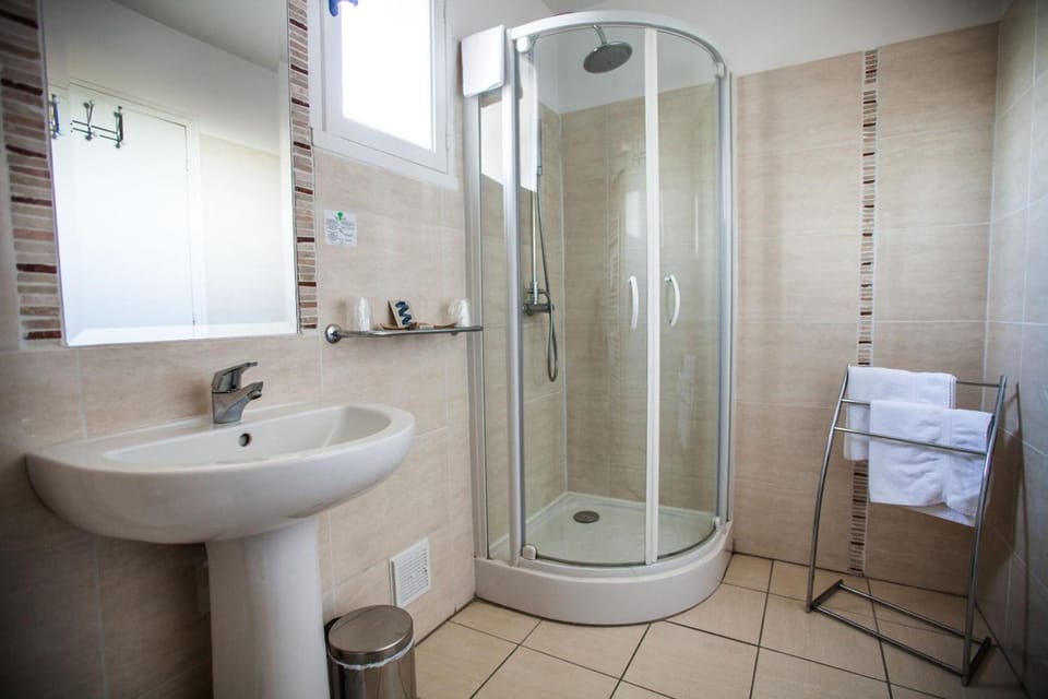 Shower, free toiletries, hair dryer, towels