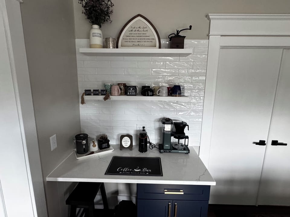 Our coffee bar provides fresh coffee beans, ground decaf, creamer and tea.