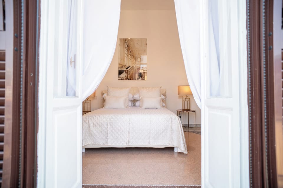 Deluxe Quadruple Room, City View | Desk, blackout drapes, free WiFi