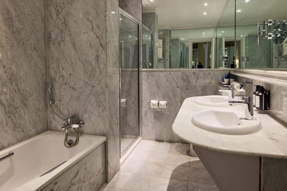 Designer toiletries, hair dryer, towels
