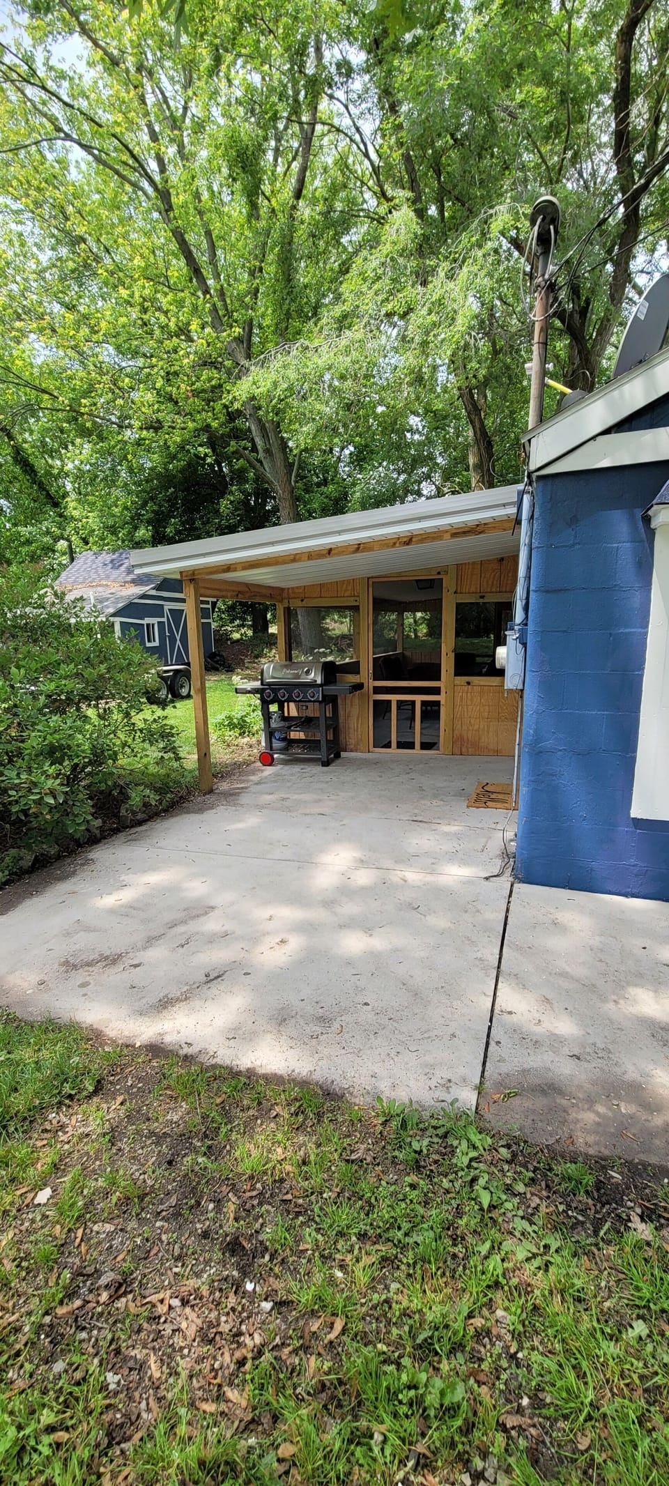 Screened porch with grill outside