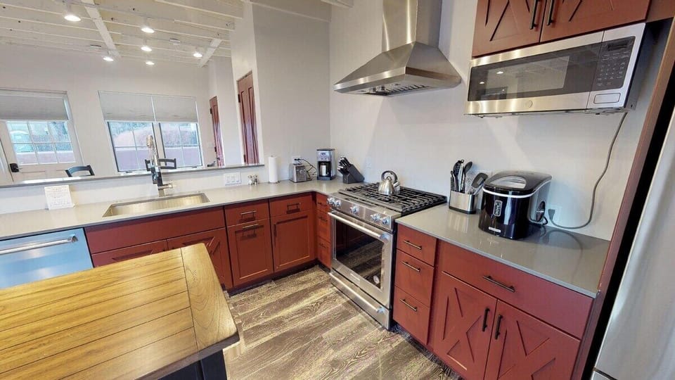 Beautiful red cabinets stocked with kitchen essentials