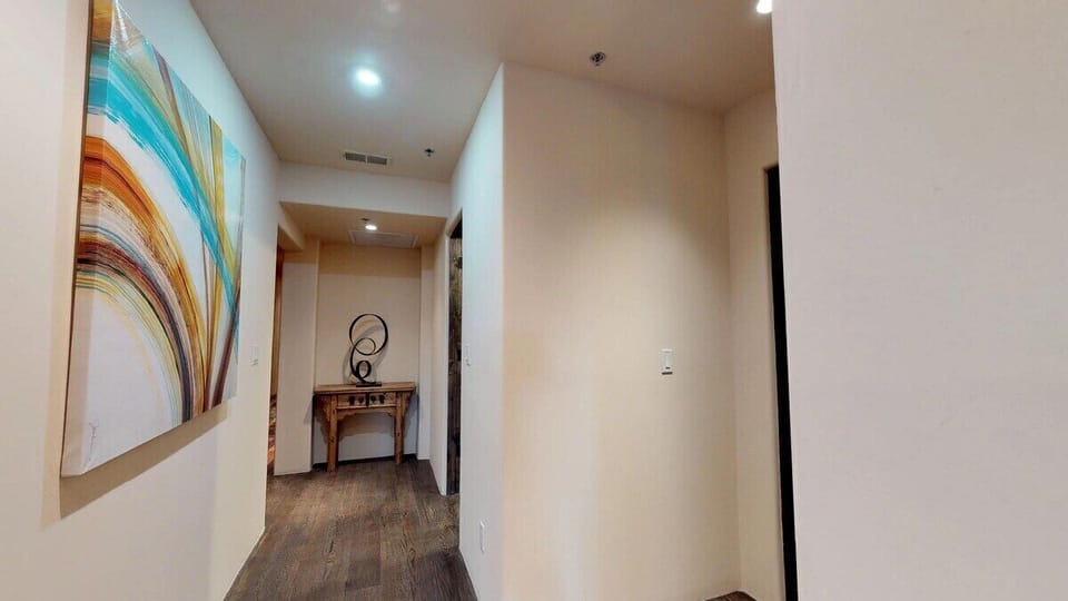 Hallway to laundry room and secondary bedroom