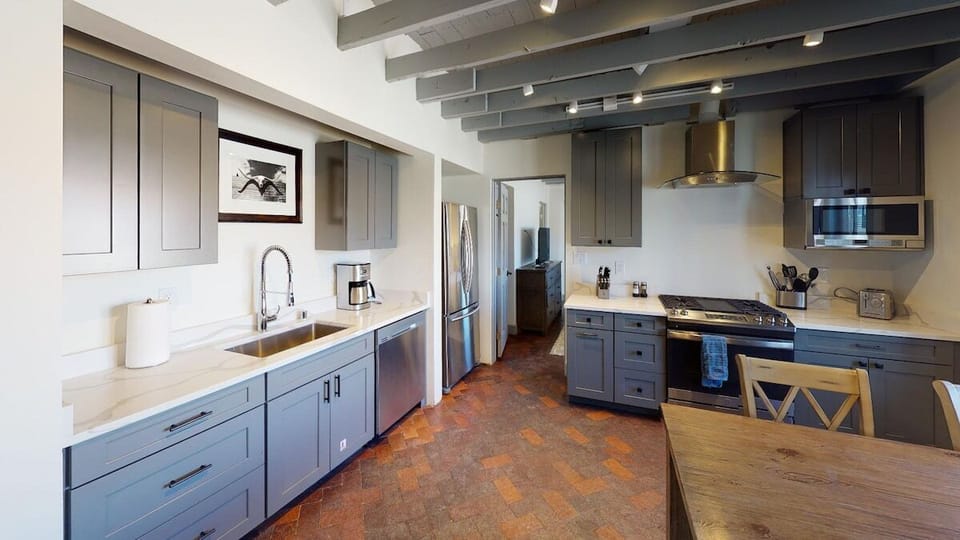 Rustic brick floors with comtemporary kitchen design